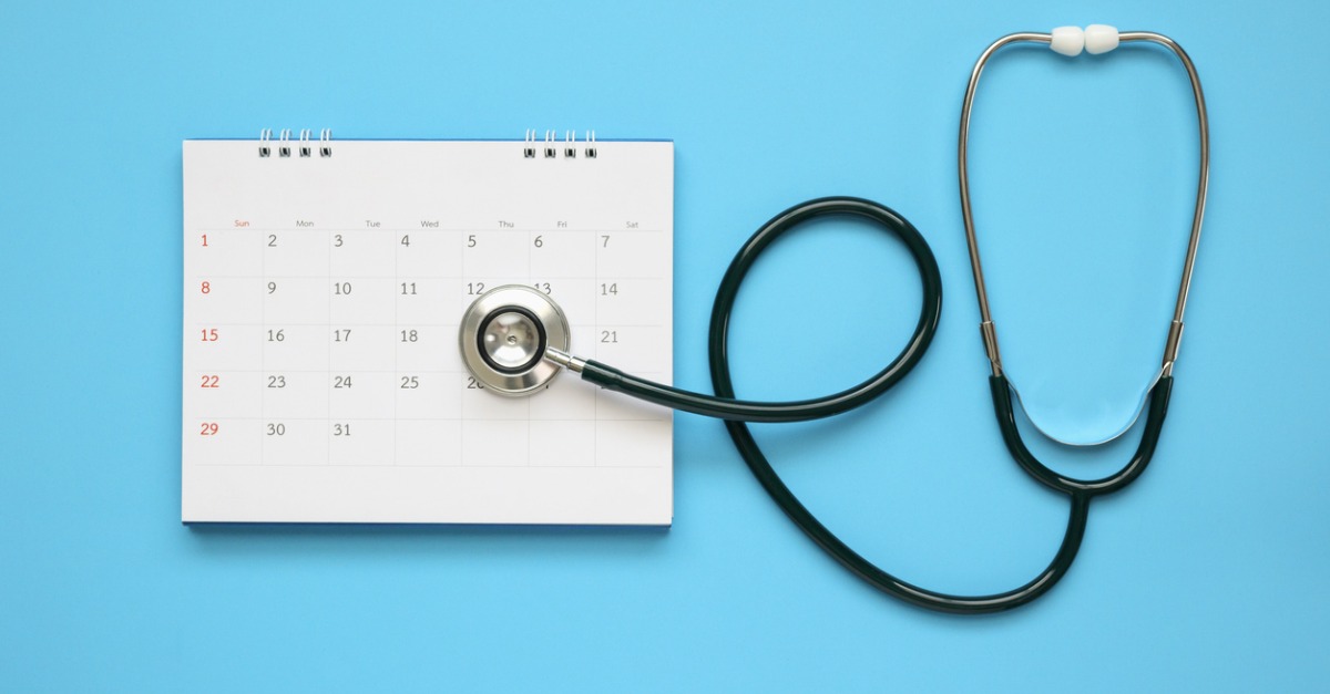 stethoscope with calendar page dat on blue background doctor picture
