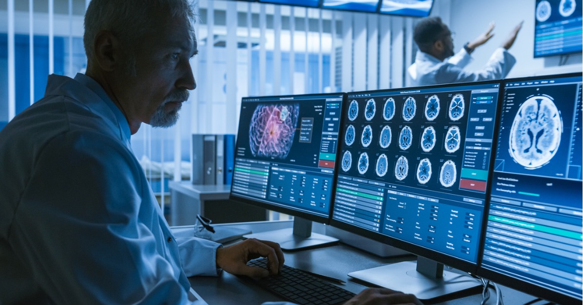 over-the-shoulder-shot-of-radiologist-working-with-ct