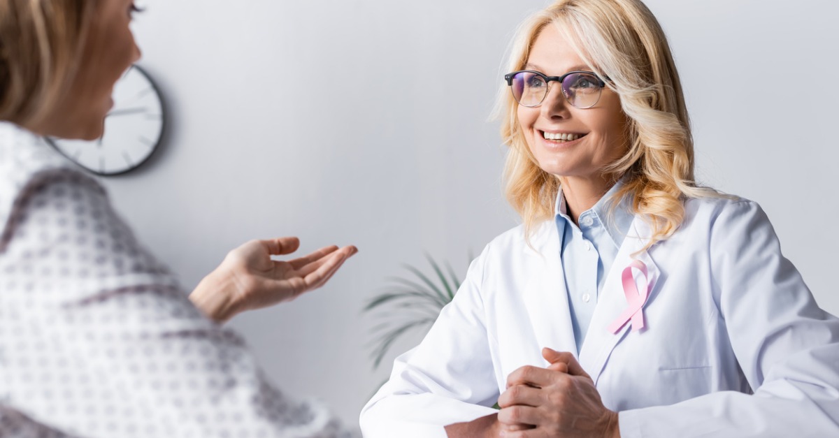 doctor discussing breast cancer education with patient