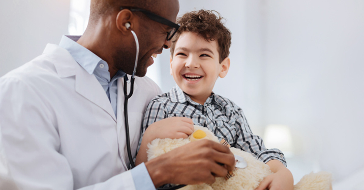 A young boy with his pediatrician.