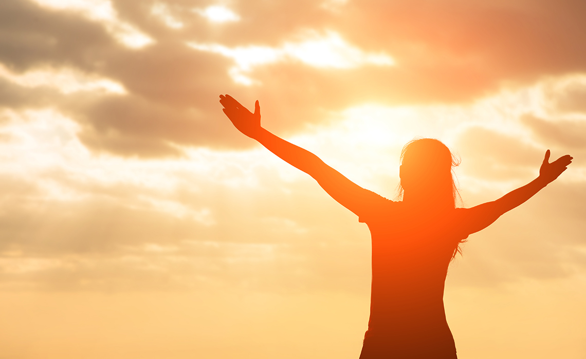 Silhouette of a breast cancer survivor enjoying good health.
