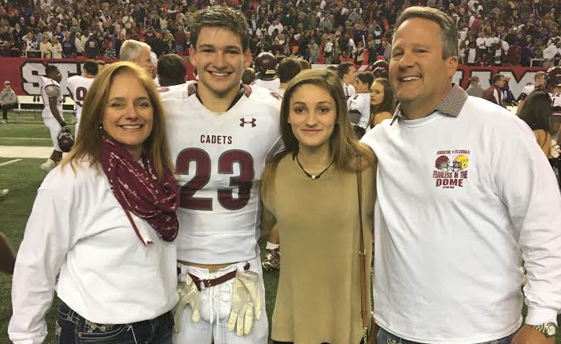Kristi Lowenthal with family members at a football game